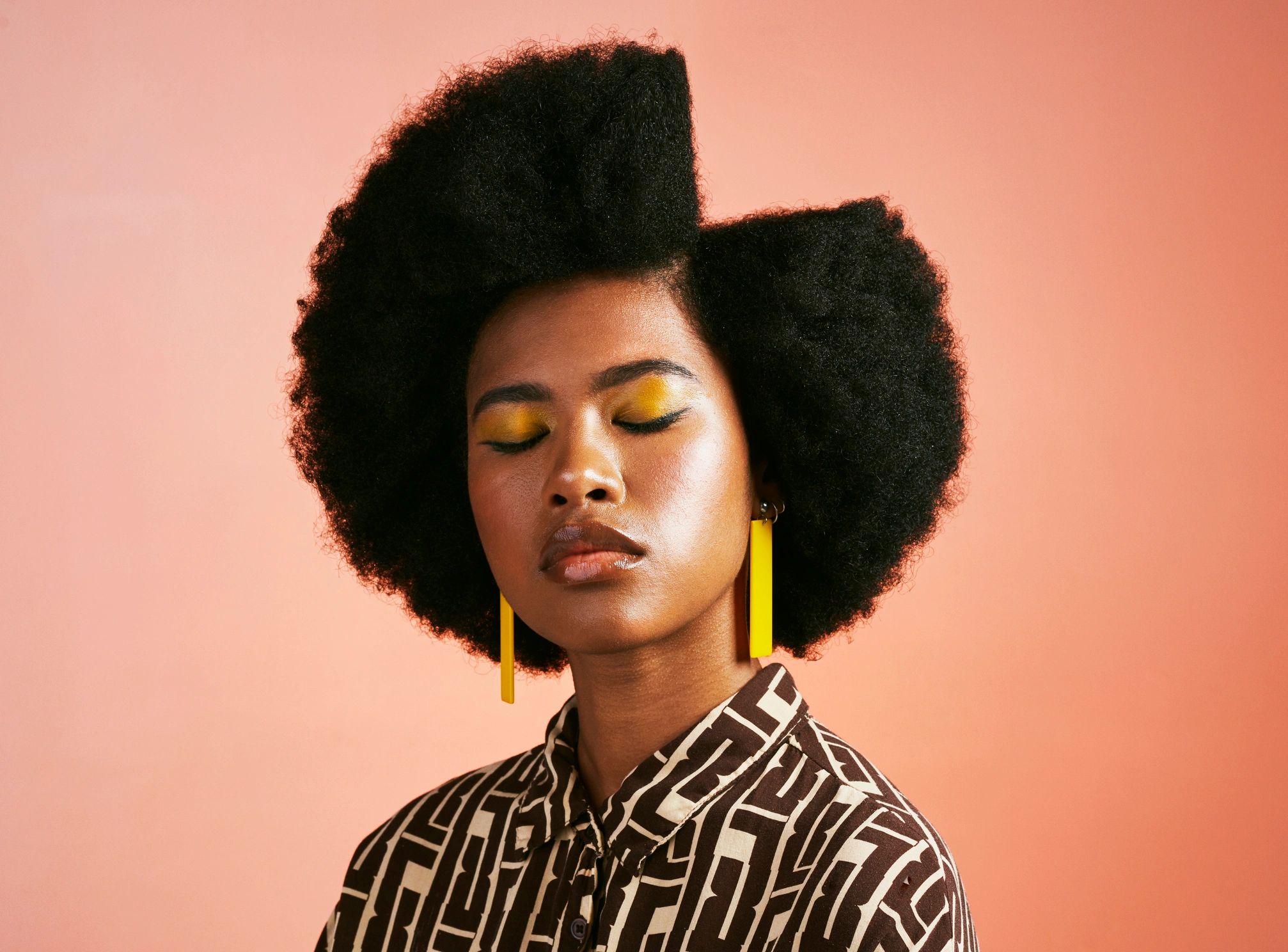 Fashion portrait in a glossy studio with bold editorial styling